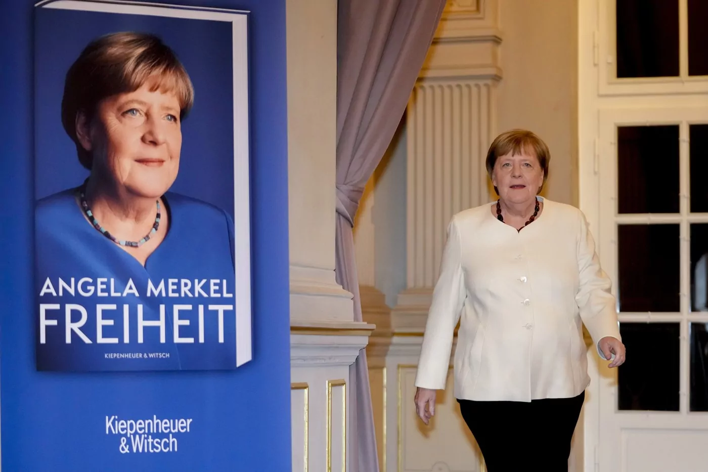 Former German Chancellor Angela Merkel arrives for the presentation of her memories in Berlin, Germany, Tuesday, Nov. 26, 2024. Book title reads "Freedom".